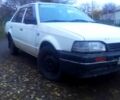 Белый Мазда 323, объемом двигателя 1.3 л и пробегом 100 тыс. км за 750 $, фото 1 на Automoto.ua