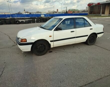 Белый Мазда 323, объемом двигателя 1.5 л и пробегом 315 тыс. км за 1400 $, фото 1 на Automoto.ua