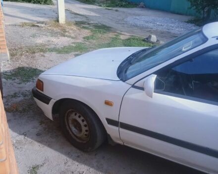 Белый Мазда 323, объемом двигателя 1 л и пробегом 320 тыс. км за 1000 $, фото 4 на Automoto.ua