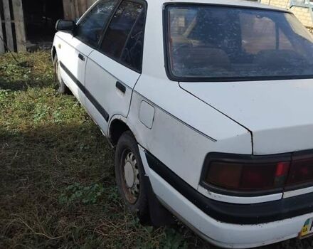 Білий Мазда 323, об'ємом двигуна 1.7 л та пробігом 300 тис. км за 600 $, фото 6 на Automoto.ua