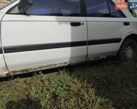 Білий Мазда 323, об'ємом двигуна 1.7 л та пробігом 300 тис. км за 600 $, фото 1 на Automoto.ua
