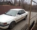 Белый Мазда 323, объемом двигателя 1 л и пробегом 335 тыс. км за 1200 $, фото 1 на Automoto.ua