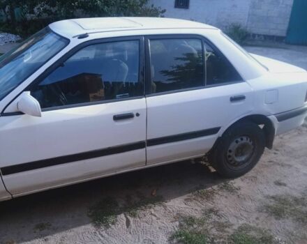 Белый Мазда 323, объемом двигателя 1 л и пробегом 320 тыс. км за 1000 $, фото 2 на Automoto.ua