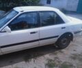Белый Мазда 323, объемом двигателя 1 л и пробегом 320 тыс. км за 1000 $, фото 2 на Automoto.ua