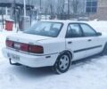 Белый Мазда 323, объемом двигателя 1.8 л и пробегом 200 тыс. км за 700 $, фото 1 на Automoto.ua