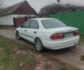 Белый Мазда 323, объемом двигателя 1.5 л и пробегом 330 тыс. км за 1850 $, фото 1 на Automoto.ua