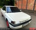 Белый Мазда 323, объемом двигателя 1.6 л и пробегом 210 тыс. км за 1500 $, фото 1 на Automoto.ua