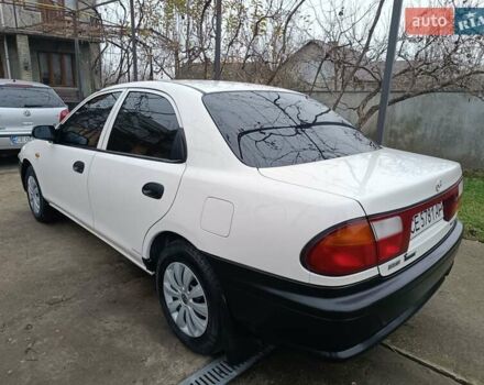 Белый Мазда 323, объемом двигателя 1.5 л и пробегом 420 тыс. км за 2750 $, фото 41 на Automoto.ua