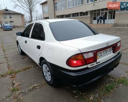 Белый Мазда 323, объемом двигателя 1.5 л и пробегом 420 тыс. км за 2750 $, фото 12 на Automoto.ua