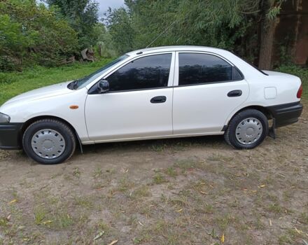 Белый Мазда 323, объемом двигателя 1.5 л и пробегом 423 тыс. км за 1850 $, фото 6 на Automoto.ua