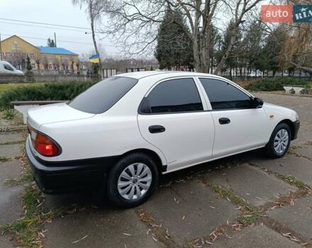 Белый Мазда 323, объемом двигателя 1.5 л и пробегом 420 тыс. км за 2750 $, фото 8 на Automoto.ua