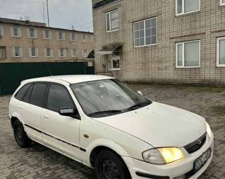 Белый Мазда 323, объемом двигателя 2 л и пробегом 300 тыс. км за 999 $, фото 2 на Automoto.ua