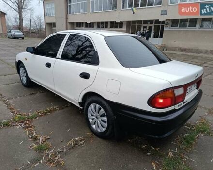 Белый Мазда 323, объемом двигателя 1.5 л и пробегом 420 тыс. км за 2750 $, фото 14 на Automoto.ua