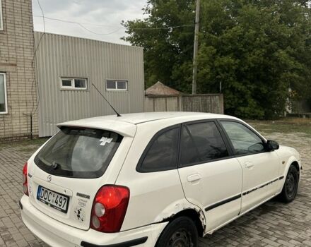 Белый Мазда 323, объемом двигателя 2 л и пробегом 300 тыс. км за 999 $, фото 3 на Automoto.ua