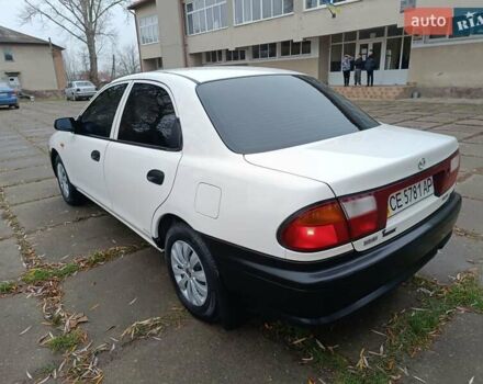 Белый Мазда 323, объемом двигателя 1.5 л и пробегом 420 тыс. км за 2750 $, фото 11 на Automoto.ua