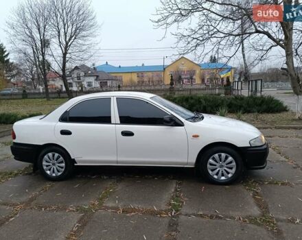 Белый Мазда 323, объемом двигателя 1.5 л и пробегом 420 тыс. км за 2750 $, фото 6 на Automoto.ua