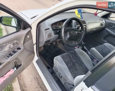 Белый Мазда 323, объемом двигателя 2 л и пробегом 280 тыс. км за 2500 $, фото 3 на Automoto.ua