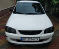 Белый Мазда 323, объемом двигателя 1.5 л и пробегом 250 тыс. км за 2500 $, фото 1 на Automoto.ua