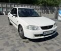 Білий Мазда 323, об'ємом двигуна 1.5 л та пробігом 213 тис. км за 1501 $, фото 1 на Automoto.ua