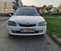 Белый Мазда 323, объемом двигателя 2 л и пробегом 280 тыс. км за 2500 $, фото 1 на Automoto.ua