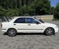 Білий Мазда 323, об'ємом двигуна 1.5 л та пробігом 213 тис. км за 1501 $, фото 1 на Automoto.ua