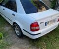 Белый Мазда 323, объемом двигателя 1.49 л и пробегом 300 тыс. км за 1500 $, фото 3 на Automoto.ua