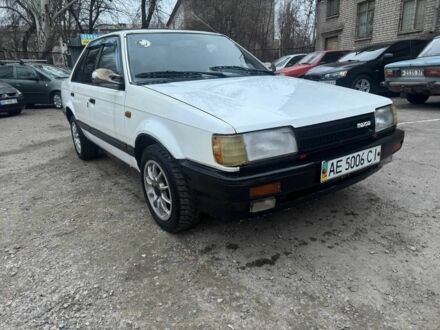 Белый Мазда 323, объемом двигателя 1.6 л и пробегом 200 тыс. км за 760 $, фото 1 на Automoto.ua