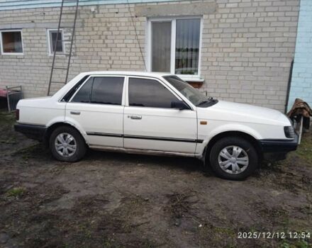 Белый Мазда 323, объемом двигателя 1.3 л и пробегом 324 тыс. км за 355 $, фото 1 на Automoto.ua