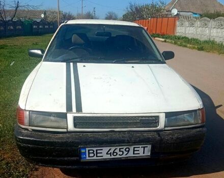 Білий Мазда 323, об'ємом двигуна 1.5 л та пробігом 590 тис. км за 1000 $, фото 1 на Automoto.ua
