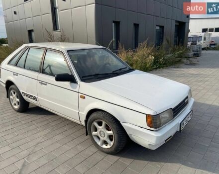 Белый Мазда 323, объемом двигателя 1.5 л и пробегом 230 тыс. км за 849 $, фото 1 на Automoto.ua