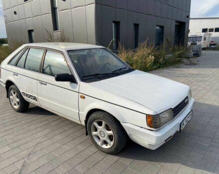 Белый Мазда 323, объемом двигателя 1.5 л и пробегом 230 тыс. км за 849 $, фото 1 на Automoto.ua