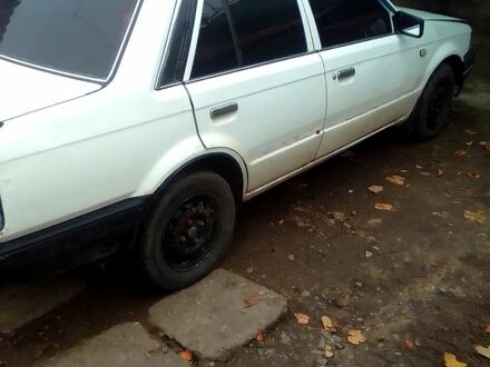 Белый Мазда 323, объемом двигателя 1.3 л и пробегом 100 тыс. км за 750 $, фото 1 на Automoto.ua