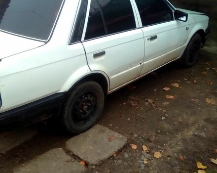 Белый Мазда 323, объемом двигателя 1.3 л и пробегом 100 тыс. км за 750 $, фото 1 на Automoto.ua