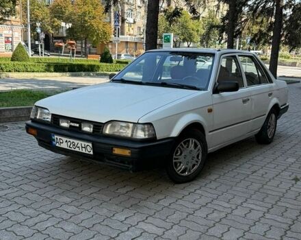 Білий Мазда 323, об'ємом двигуна 1.3 л та пробігом 287 тис. км за 850 $, фото 1 на Automoto.ua