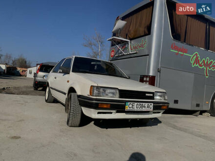 Белый Мазда 323, объемом двигателя 1.3 л и пробегом 300 тыс. км за 1000 $, фото 1 на Automoto.ua