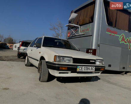 Білий Мазда 323, об'ємом двигуна 1.3 л та пробігом 300 тис. км за 850 $, фото 1 на Automoto.ua