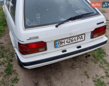 Белый Мазда 323, объемом двигателя 1.49 л и пробегом 350 тыс. км за 599 $, фото 1 на Automoto.ua