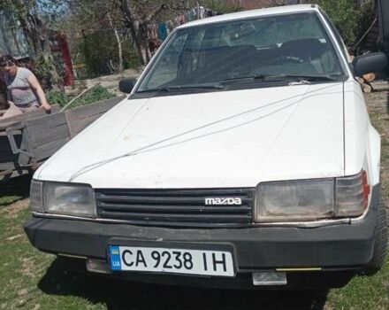 Белый Мазда 323, объемом двигателя 1.3 л и пробегом 350 тыс. км за 457 $, фото 1 на Automoto.ua