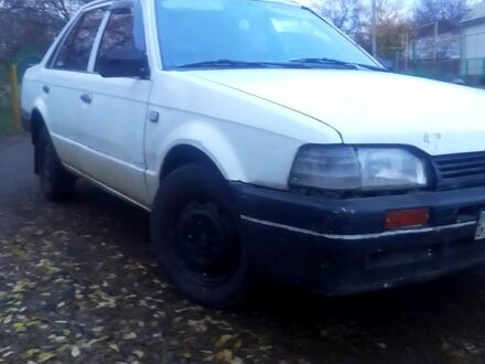 Білий Мазда 323, об'ємом двигуна 1.3 л та пробігом 100 тис. км за 750 $, фото 1 на Automoto.ua