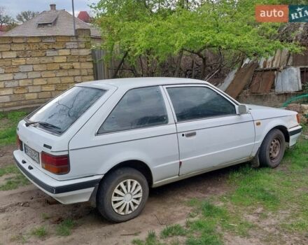 Белый Мазда 323, объемом двигателя 1.49 л и пробегом 350 тыс. км за 550 $, фото 1 на Automoto.ua