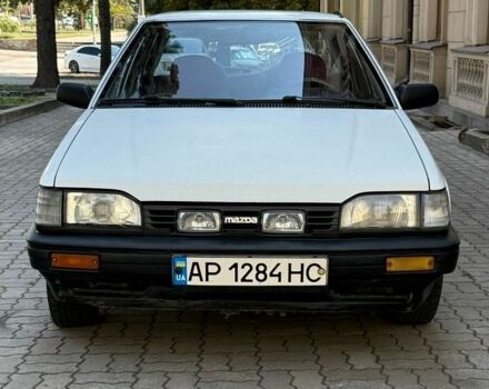 Белый Мазда 323, объемом двигателя 1.3 л и пробегом 287 тыс. км за 850 $, фото 1 на Automoto.ua