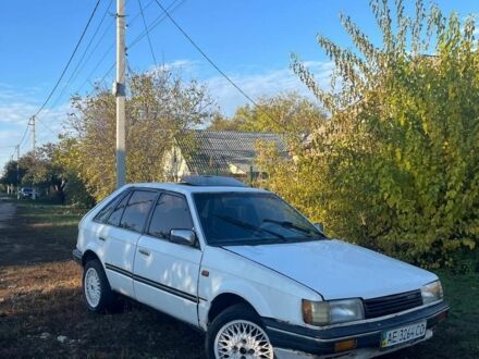 Білий Мазда 323, об'ємом двигуна 3 л та пробігом 500 тис. км за 715 $, фото 1 на Automoto.ua