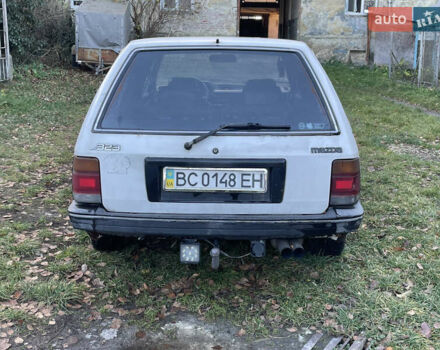 Белый Мазда 323, объемом двигателя 1.69 л и пробегом 200 тыс. км за 600 $, фото 1 на Automoto.ua