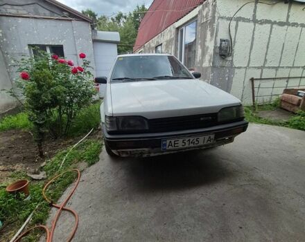 Белый Мазда 323, объемом двигателя 1.49 л и пробегом 410 тыс. км за 700 $, фото 1 на Automoto.ua