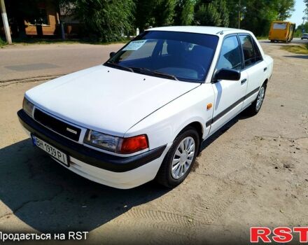 Білий Мазда 323, об'ємом двигуна 1.8 л та пробігом 89 тис. км за 1550 $, фото 1 на Automoto.ua