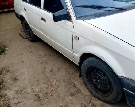 Белый Мазда 323, объемом двигателя 1.3 л и пробегом 287 тыс. км за 400 $, фото 1 на Automoto.ua