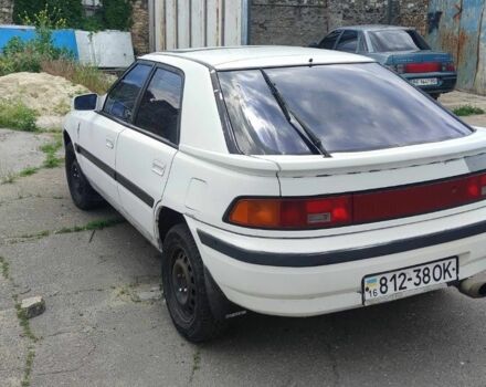 Белый Мазда 323, объемом двигателя 0 л и пробегом 150 тыс. км за 700 $, фото 1 на Automoto.ua