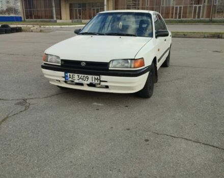 Белый Мазда 323, объемом двигателя 1.5 л и пробегом 315 тыс. км за 1400 $, фото 1 на Automoto.ua
