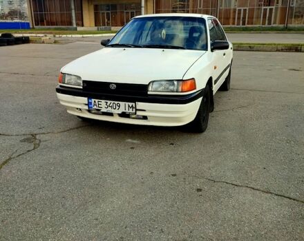 Білий Мазда 323, об'ємом двигуна 1.5 л та пробігом 315 тис. км за 1400 $, фото 1 на Automoto.ua