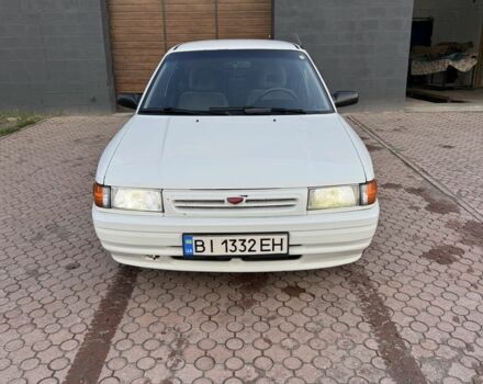 Белый Мазда 323, объемом двигателя 1.6 л и пробегом 350 тыс. км за 1850 $, фото 1 на Automoto.ua